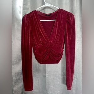 A size small burgundy long sleeve blouse, very semi cropped 🤩